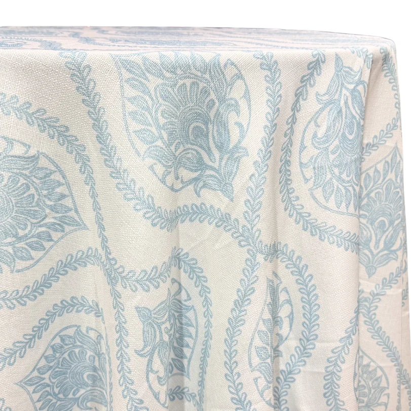 Blue and white toile table linen with a delicate blue botanical pattern
