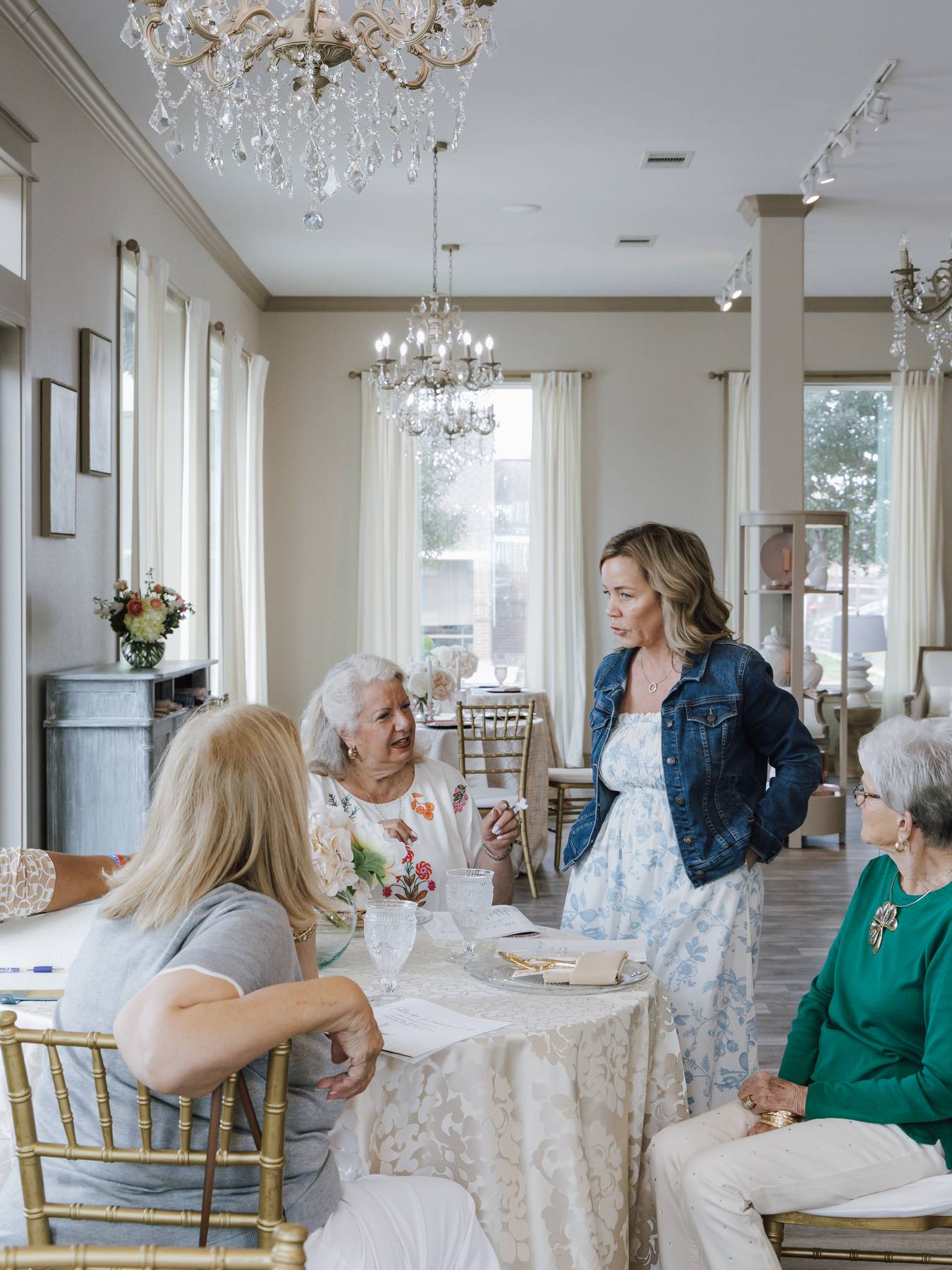 Guests in conversation around a dressed table at a workshop